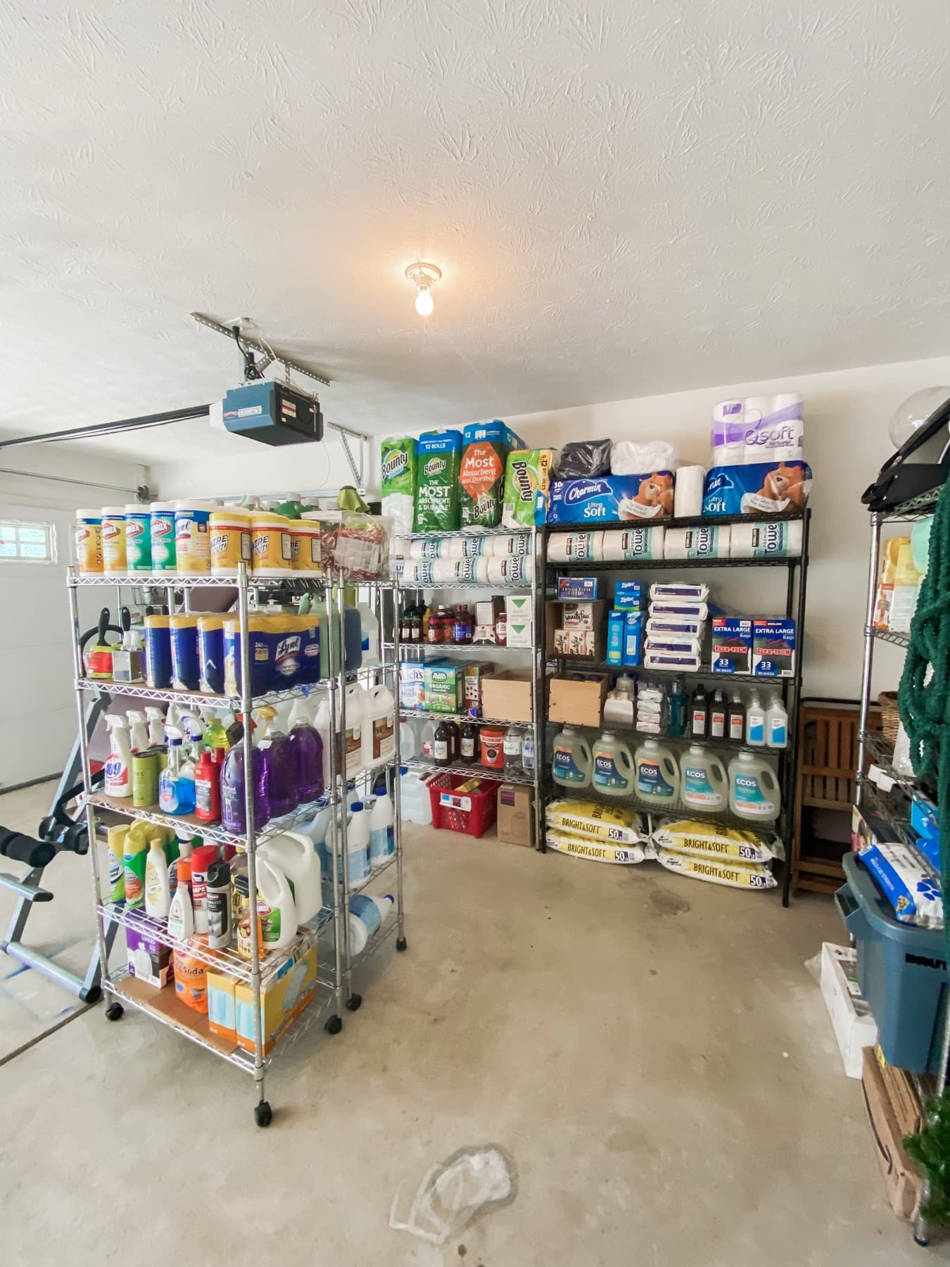 After, a zoned garage with labeled shelving and a clear, walkable floor.